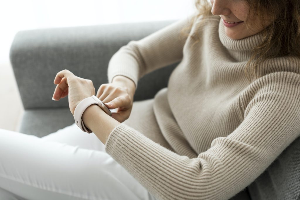 Woman looking at smartwatch wearable technology